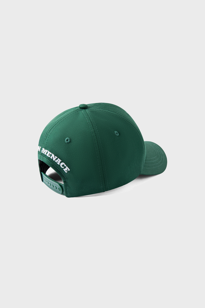 The Maison Menace Signature Hat in Cactus by MAISON MENACE is a green baseball cap with an adjustable strap, featuring signature MENACE embroidery in white on the back panel against a plain light gray background.