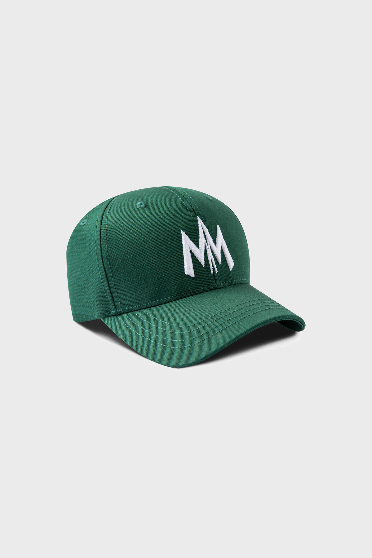 The Maison Menace Signature Hat in Cactus from MAISON MENACE displays a white MM logo on the front, complemented by a curved brim and top button for added style.