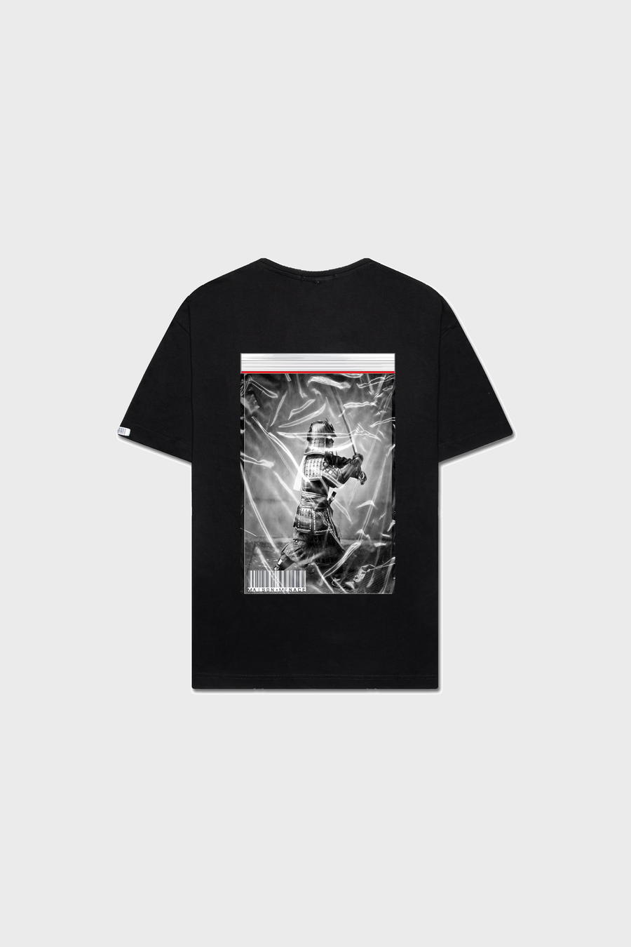 The Limited Edition Black MAISON MENACE Bushido T-Shirt, made from Organic American Grown SUPIMA® cotton, features a medieval knight in helmet and armor on the back with a plastic-wrapped effect against a plain gray background.
