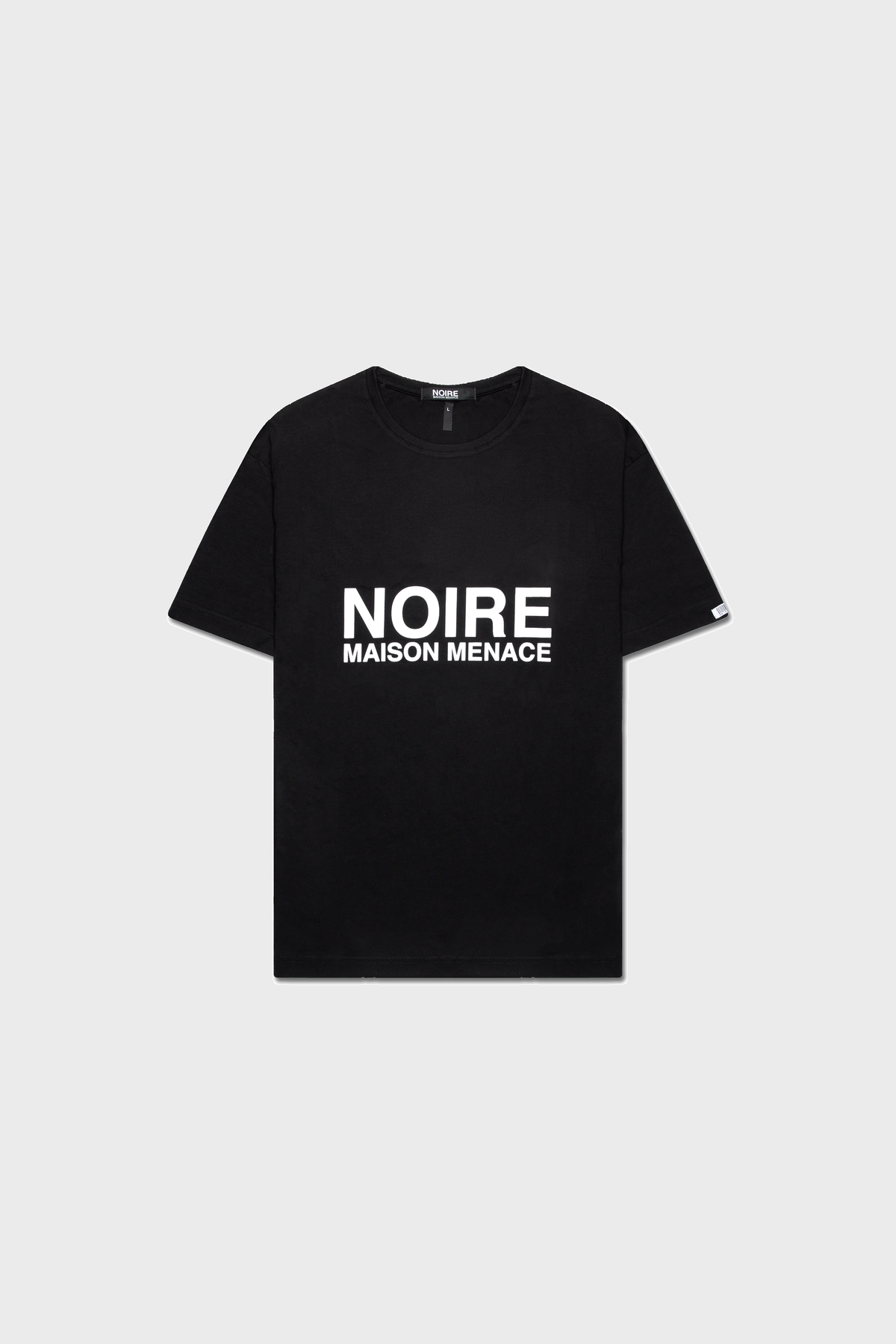 A black Noire Classic T-Shirt by MAISON MENACE, made from soft SUPIMA® cotton with a bold white NOIRE MAISON MENACE graphic on the front, set against a plain gray background.