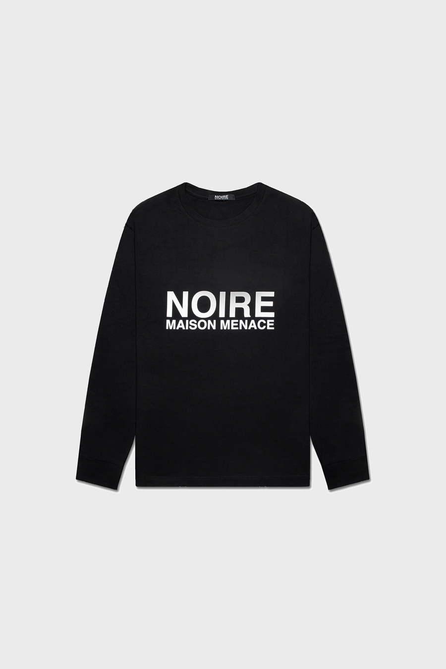 The Noire Classic Long Sleeve Shirt by MAISON MENACE is crafted from organic American Grown SUPIMA® cotton, featuring the bold NOIRE MAISON MENACE print in white capital letters on a neutral gray background.