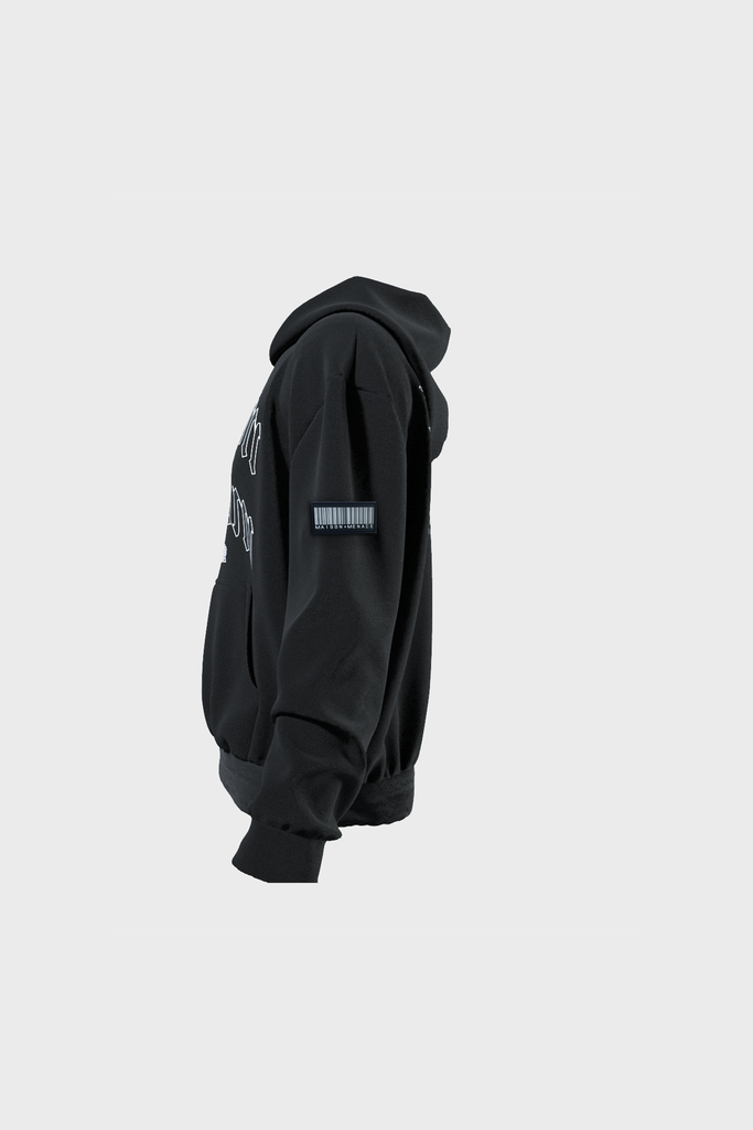 Side view of a black heavyweight cotton Old London Hoodie by MAISON MENACE on a plain background, featuring gothic text print on the front and a barcode design patch on the left sleeve. The hoodie has an oversized fit with ribbed hem and cuffs.