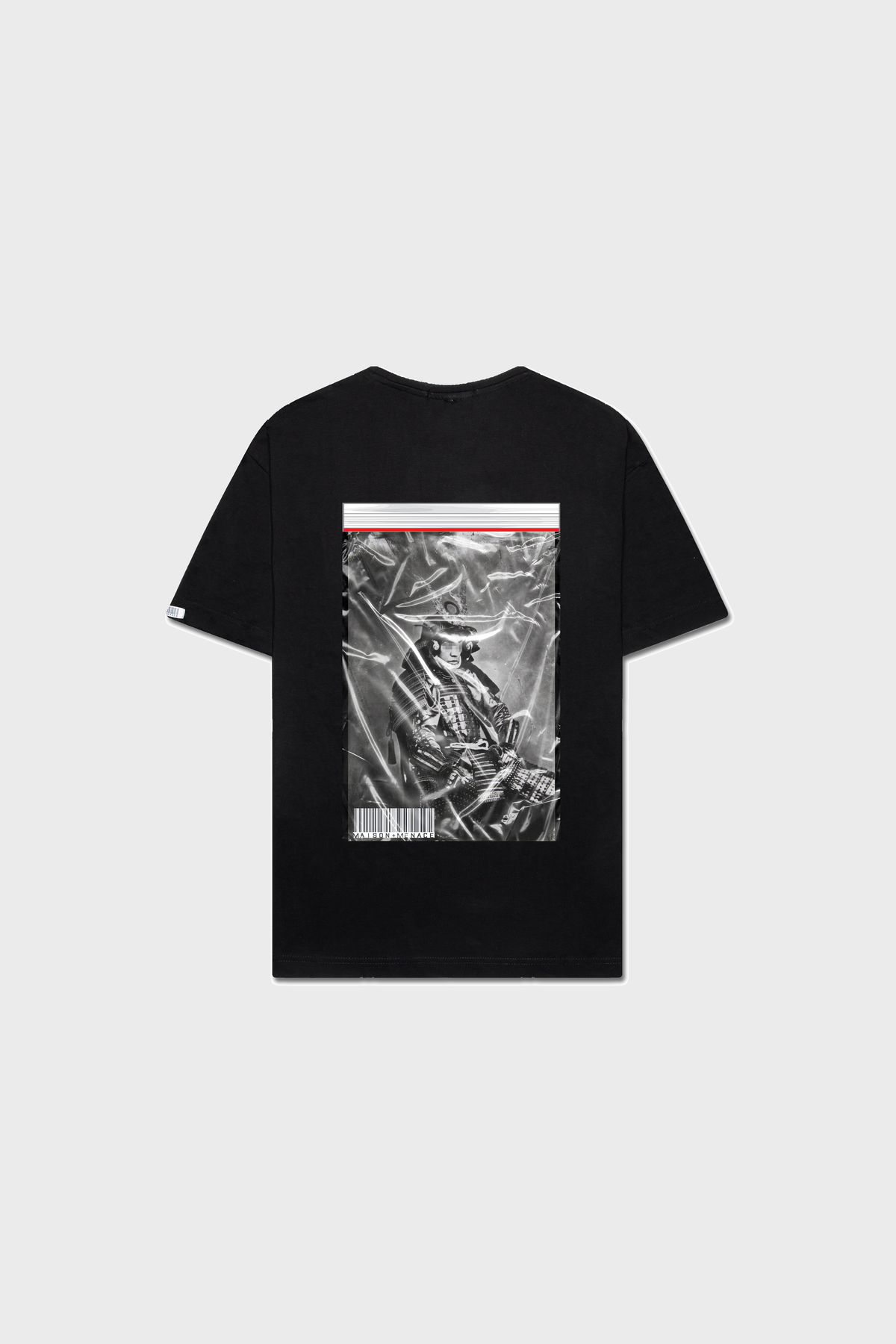 The MAISON MENACE Samurai T-Shirt is a limited edition black tee made from soft SUPIMA® cotton. It features a back graphic with a skeleton in a helmet holding a sword, complemented by a crumpled paper effect, thin red stripe, and barcode for an edgy look.