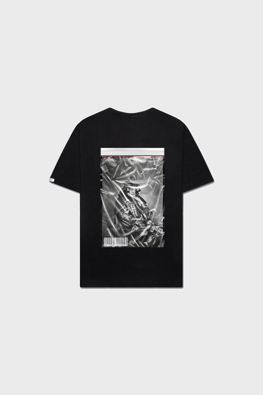 The MAISON MENACE Samurai T-Shirt is a limited edition black tee made from soft SUPIMA® cotton. It features a back graphic with a skeleton in a helmet holding a sword, complemented by a crumpled paper effect, thin red stripe, and barcode for an edgy look.